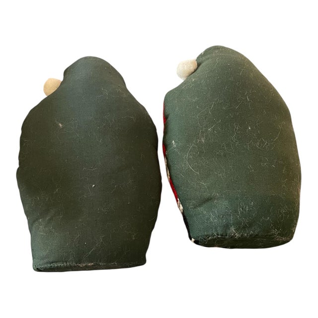 2 vintage needlepoint plush pillows of Santa Claus holding an orange kitty. These pillows are weighted in the bottom so...