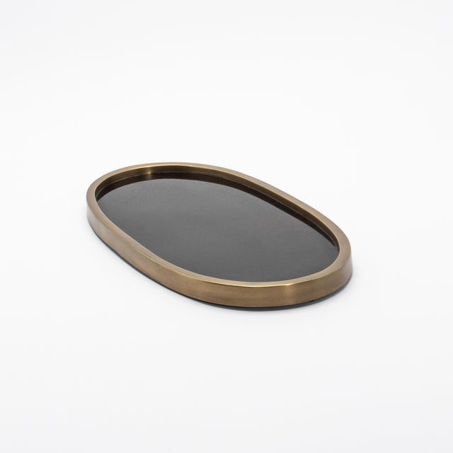 The Kifu Paris Oval Tray in pen shell is an exquisite fusion of nature's brilliance and artisanal craftsmanship. The...