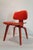 Wonderful red aniline dyed DCW by Charles and Ray Eames. Early 5-2-4 screw pattern. Not labeled.