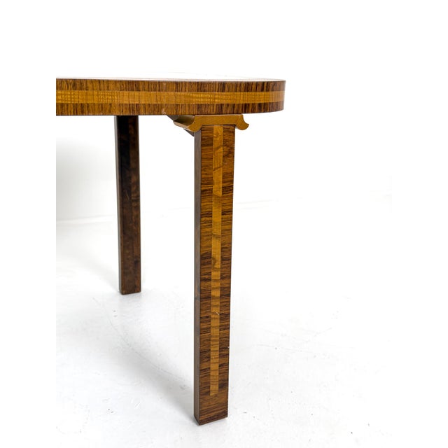 A rare and elegant Swedish Art Deco coffee table designed by Birger Ekman and produced in Sweden during the 1930s. The...