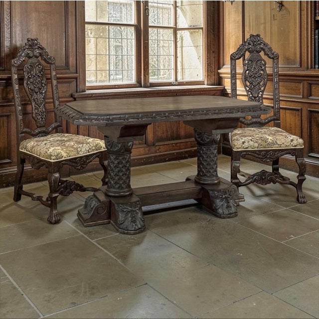 A stately pair of Italian Renaissance Revival side chairs dating to the late 19th century, distinguished by their grand...