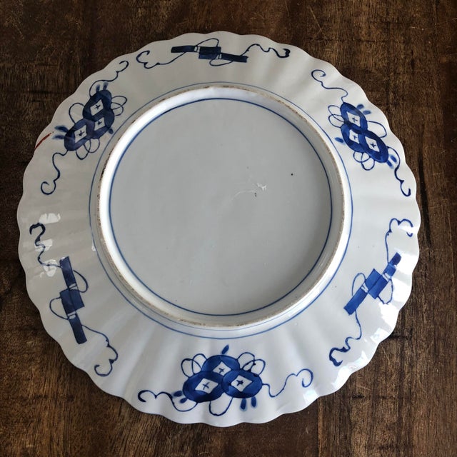A good Japanese Imari charge in beautiful condition. Deep cobalt and terra-cotta decoration with small gold accents. Lobed...