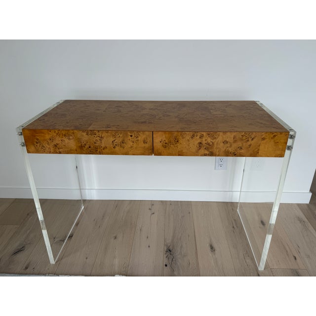 A striking blend of glamour and minimalism, this “Bond” desk by Jonathan Adler pairs richly burled Mappa wood with sleek...