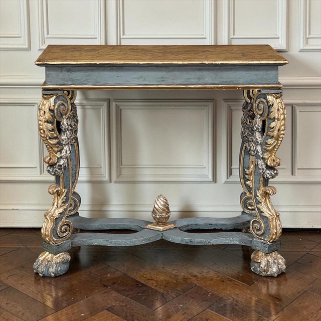 Early 19th Century Italian Baroque Faux-Sienna Marble Console hails from Florence, whose rich history in art and...