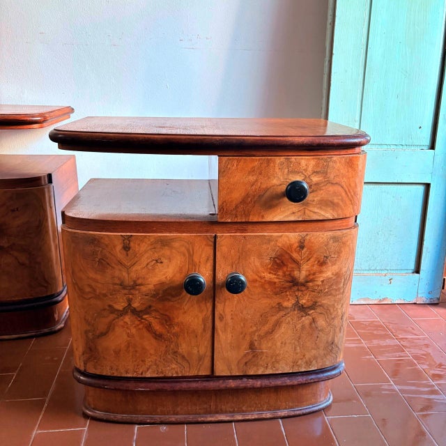Beautiful pair of Art Deco style bedside tables, made of wood with burl veneer, Italian craftsmanship from the 1950s. The...