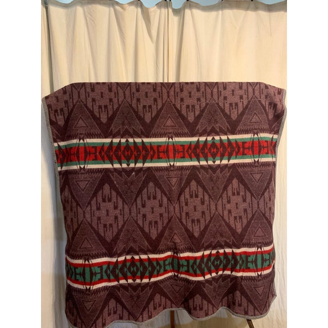 This Pendleton blanket is the Cayuse Indian blanket pattern . It is in vintage condition . Its rich reds , greens and...