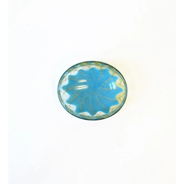 A beautiful small oval Italian Murano sky blue and gold art glass bowl, circa mid-20th century, Italy. Great as a...