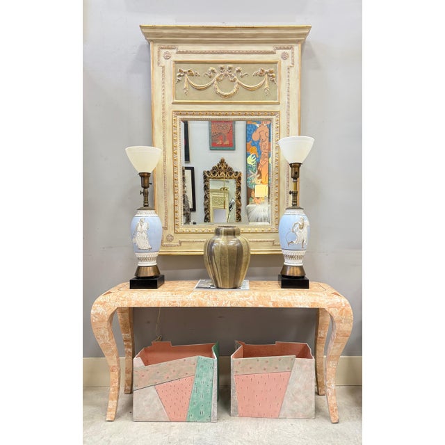 Vintage Carved Wood Beveled Trumeau Mirror in Louis XVI Style, Painted and Gilt Offered for sale is a vintage Louis XVI...