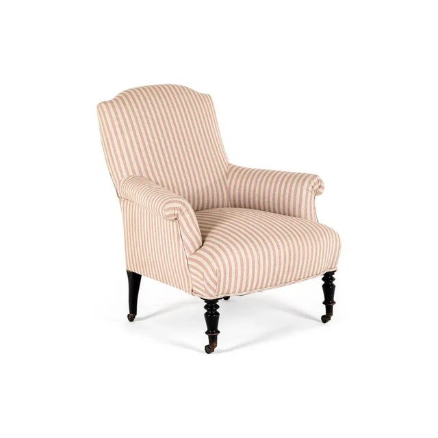 A 19th century french napoleon iii curved back armchair with a tall back and a wide generous seat. The beech frame is...