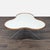 Designed by Christine Schwarzer with an organic shape and stem-like structure. The top is laminate and wood. The base is...