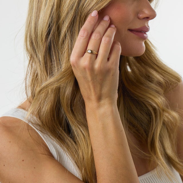This elegant Victorian solitaire ring is a beautifully understated jewel from the 1900’s, centered by an old mine cut...