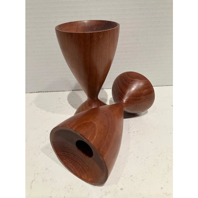 Add warm Scandinavian charm to your home with this beautiful set of two Vintage Mid-Century Modern Teak Candle Holders....