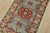 A tribal Caucasian Kazak rug hand-knotted with fine wool on a cotton foundation. This rug features a central medallion...