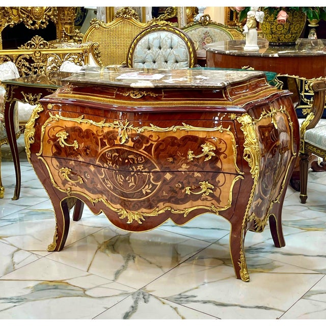 Experience the grandeur of European craftsmanship with this magnificent French Rococo-inspired dresser, masterfully...