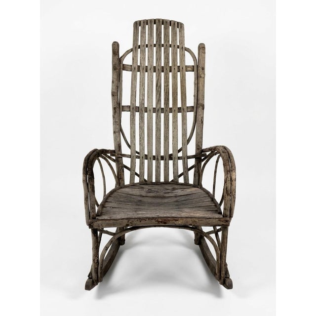 Very nice handmade twig rocking chair probably Adirondack. Very sturdy and surprisingly comfortable! Wonderful authentic...