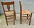 A Pair of Early 19th Century Rush Seated Elm Hall Chairs This is a good quality pair of Elm chairs they have multiple...