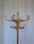 Vintage bentwood coat stand made from light-toned beech wood. The design features elegantly curved hooks, a circular...