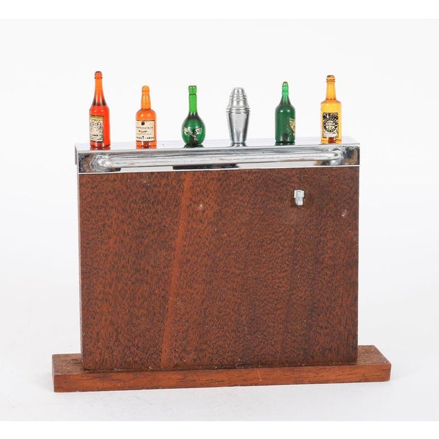 A superb novelty miniature Art Deco cocktail stick set, circa 1940 in date. The set comprises six removable coloured glass...