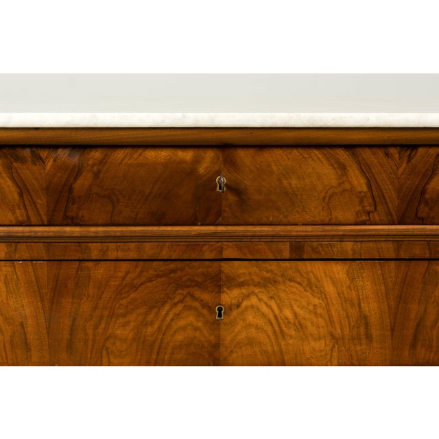 Sourced in Provence, France, this mid-19th century Louis Philippe commode is veneered in richly figured walnut and retains...