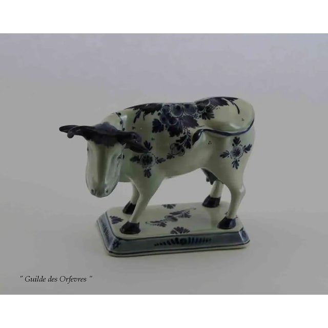 Ref # Delft 1551 Photo 568 Description : A Cow with Blue Floral Decoration was made in Delft, Holland Pattern : Blue...