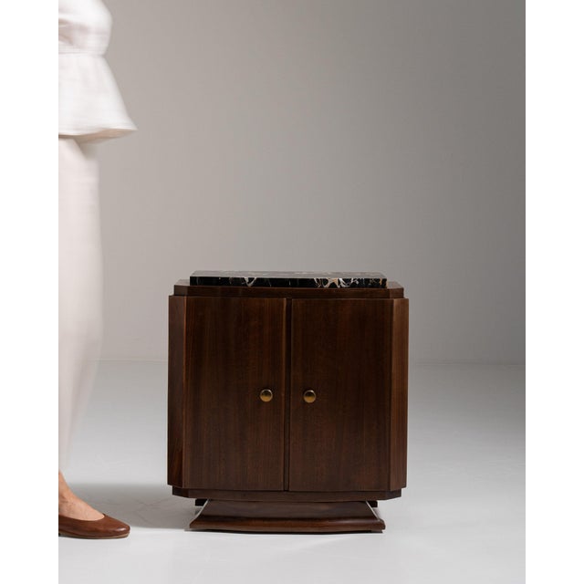 Art deco marble-top bar cabinet in Rich Walnut Brown. Its rich walnut brown finish sets off black marble top, two-door...