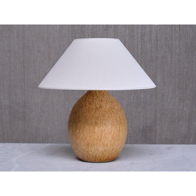 This rare, substantial table lamp was designed by Bruno Karlsson and produced by Ego Stengods Ateljé in Sweden during the...