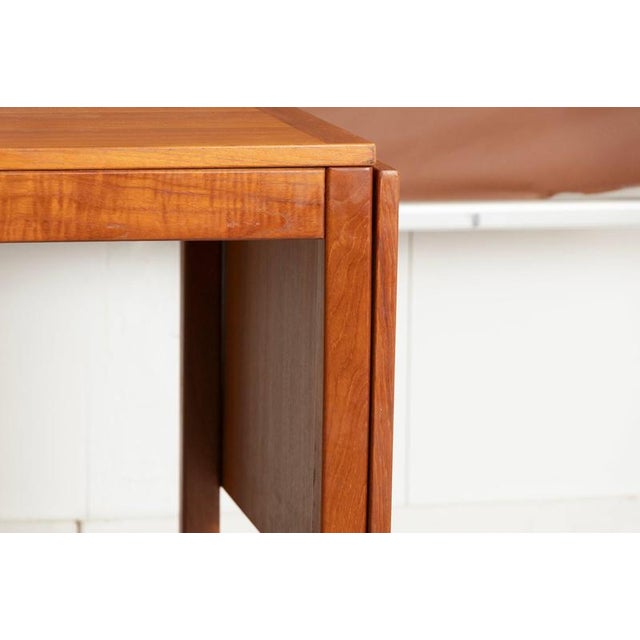 A danish midcentury teak dining table by vejle stole, produced during the 1970s with a clean-lined architectural form...