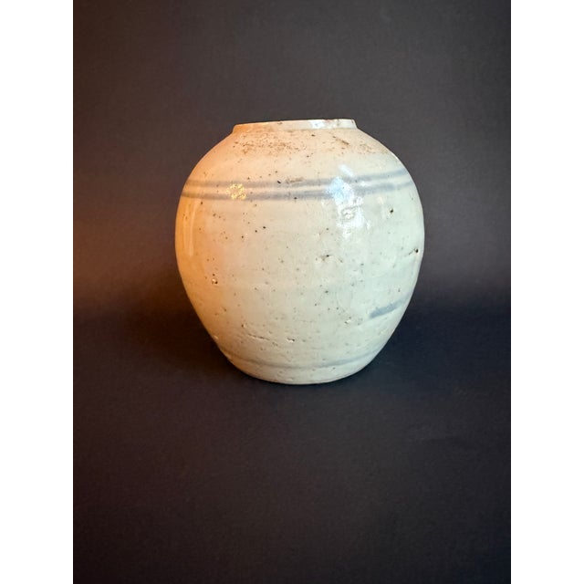 This lovely small cream/grey Chinese ginger jar with Blue designs, possibly of Ming dynasty, but unauthenticated. The...