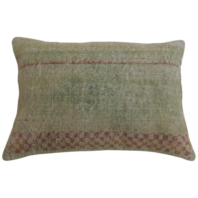 A large pillow made from a shabby chic Turkish deco rug. Measures: 18” x 25”.