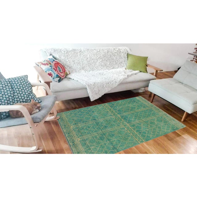 A mesmerizing addition to any decor, this exhilarating hand-knotted rug featuring exquisite coloration in an intricate...