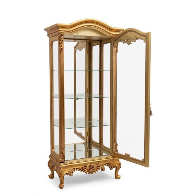 display cabinet showcase in gold leaf with three glass shelves and the back is mirrored. Dimensions Width of 32” × 17”...