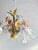 Vintage floral tole chandelier from the 1970s, hand-painted daisy flowers, green foliage, and five original frosted glass...