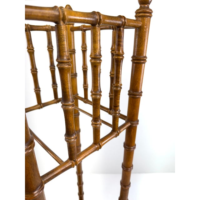 A finely crafted early 20th century plant stand rendered in turned wood to imitate bamboo, a popular design motif of the...