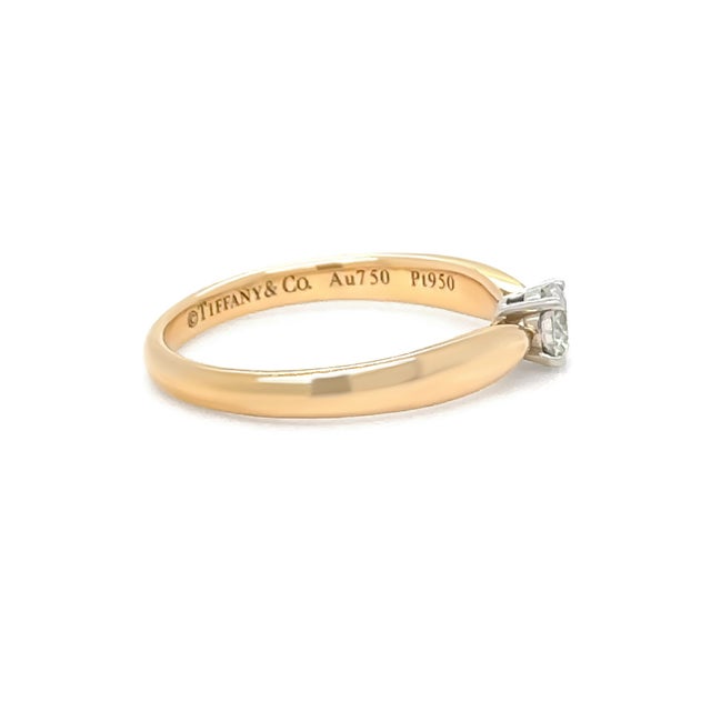 An elegant Tiffany & Co. Harmony ring crafted in 18ct rose gold and platinum, featuring a round brilliant cut diamond in a...
