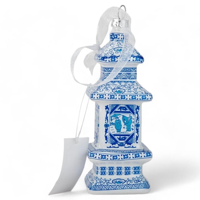 Pair of contemporary Chinoiserie glass ornaments featuring a beautiful blue and white pagoda design. They are perfect on a...