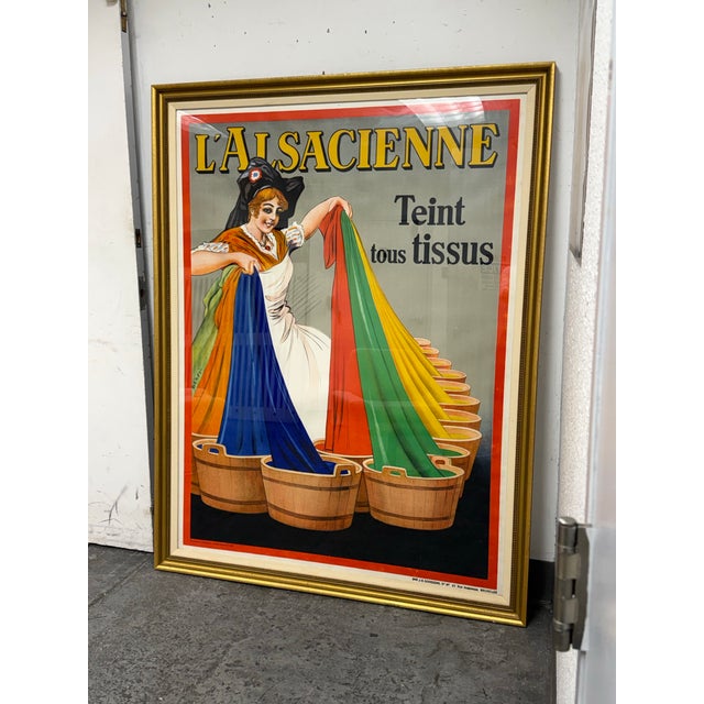 Design Plus Gallery presents a L’Alsacienne Original Custom Framed Poster, Circa 1920s. This original advertising poster...