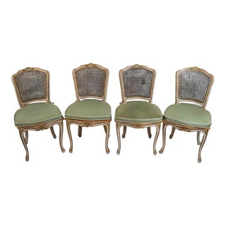 Mid 20th Century Set of Four Louis XV Style Parcel Gilt Wood Caned Side Chairs For Sale
