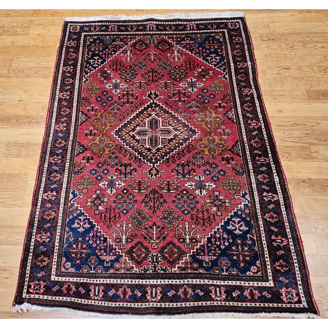"Discover the distinctive charm and intricate artistry of this Vintage Persian Joshegan Area Rug, a remarkable handwoven...