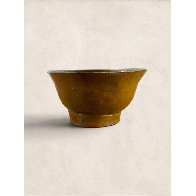 A charming antique English stoneware jelly mould dating to circa 1900. Featuring a warm buff-colored exterior and a pale...