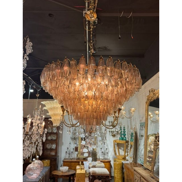 The Modern Murano Poliheder Glass Chandelier in Fume' is a stunning and unique lighting fixture that showcases the...
