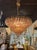 The Modern Murano Poliheder Glass Chandelier in Fume' is a stunning and unique lighting fixture that showcases the...
