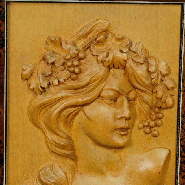A lovely wooden wall application depicting a Victorian lady with grapes and wine leaves in her hair. handcarved circa 1920...