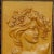 A lovely wooden wall application depicting a Victorian lady with grapes and wine leaves in her hair. handcarved circa 1920...