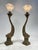 Beautiful pair of golden brass table lamps, in perfect 1920s Art Nouveau style; depicting two mythological fish, with...