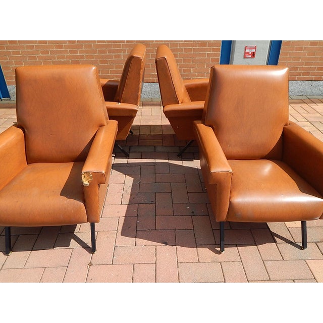 Rare group of n° 4 armchairs Identical Italian production 50s Black iron legs with brass feet Leatherette cover to replace...