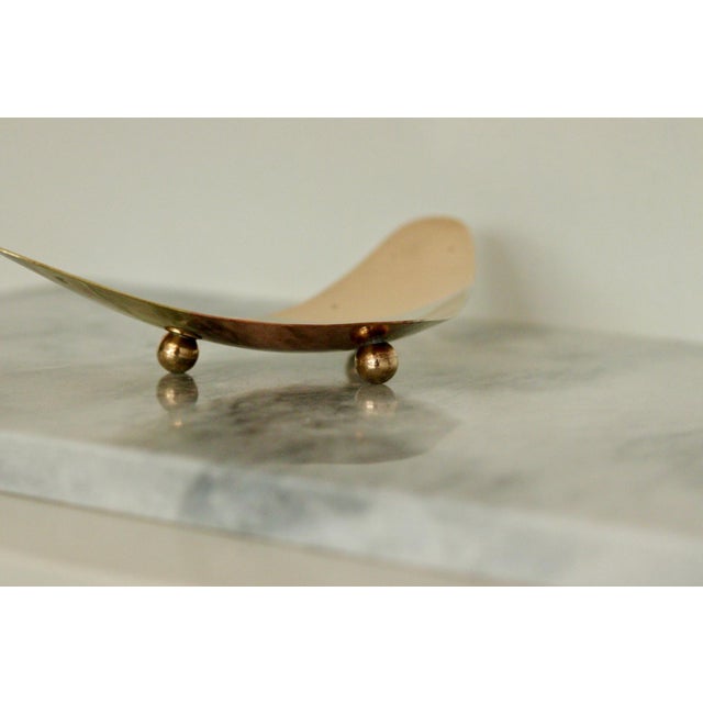 A beautiful vintage dish, made with a combination of metals and sitting on balled feet. Consisting of gold, silver, brass...