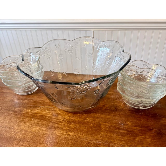 These are vintage Anchor Hocking “Savannah” pattern salad bowl and eight individual serving bowls featuring an ornate...
