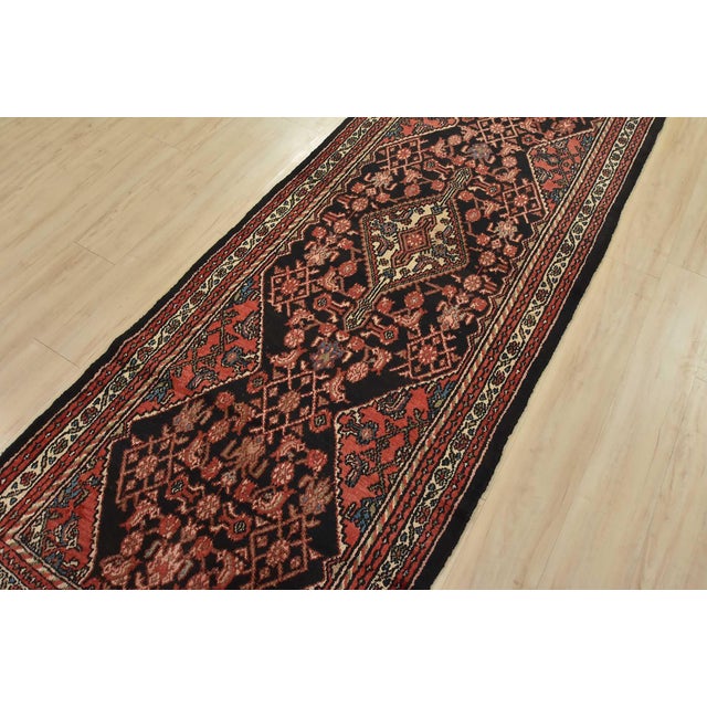 This authentic vintage tribal Hamedan runner is hand-knotted with fine wool and natural dyes. This nomadic oriental rug...