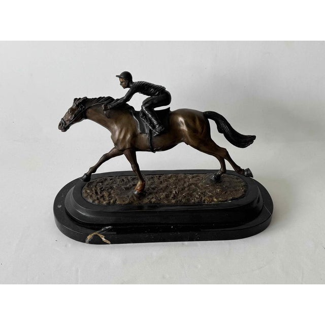 C.Charles signed bronze sculpture of jockey on race horse statue. The design of this sculpture draws inspiration from Art...