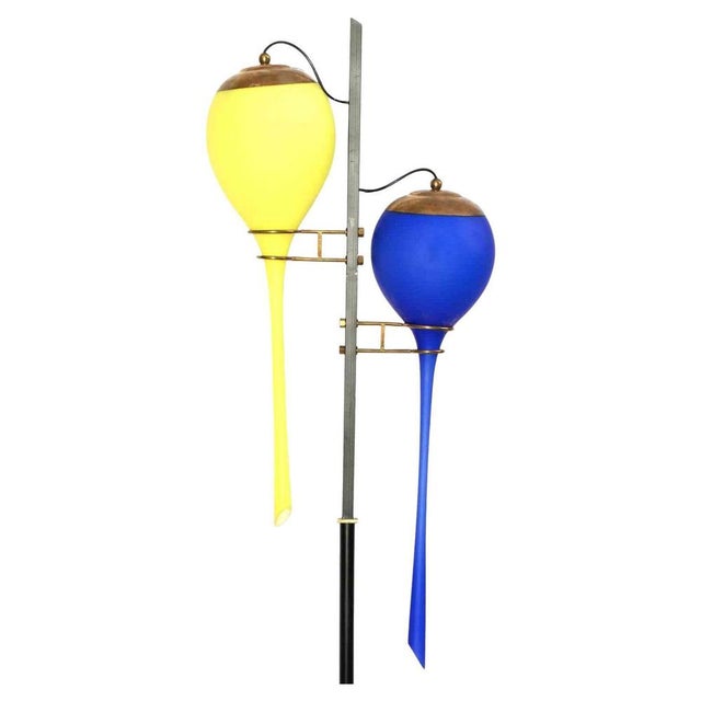 Yellow and Blue Stilnovo lamp is a design item realized in the mid-20th Century for Stilnovo. Marble base, black painted...